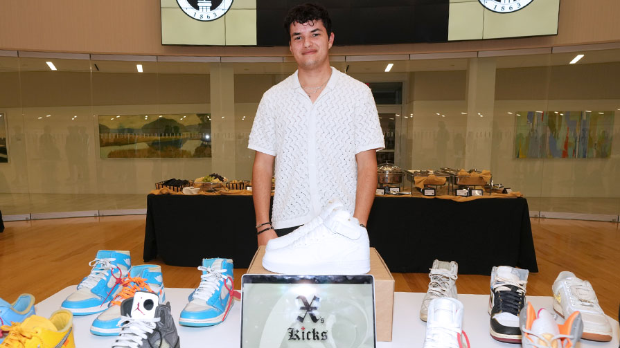 Xavier Perez with table of sneakers.