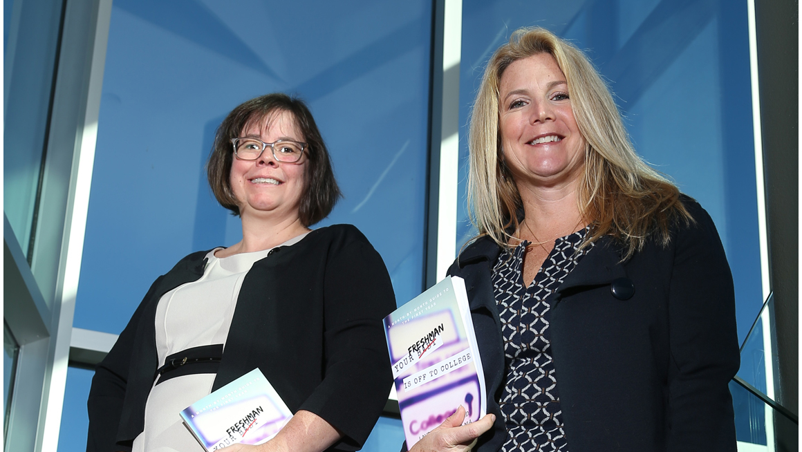 Assistant Dean for Student Success Laurie L. Hazard, Ed.D., and Director of the Academic Center for Excellence Stephanie K. Carter hold the book they co-wrote