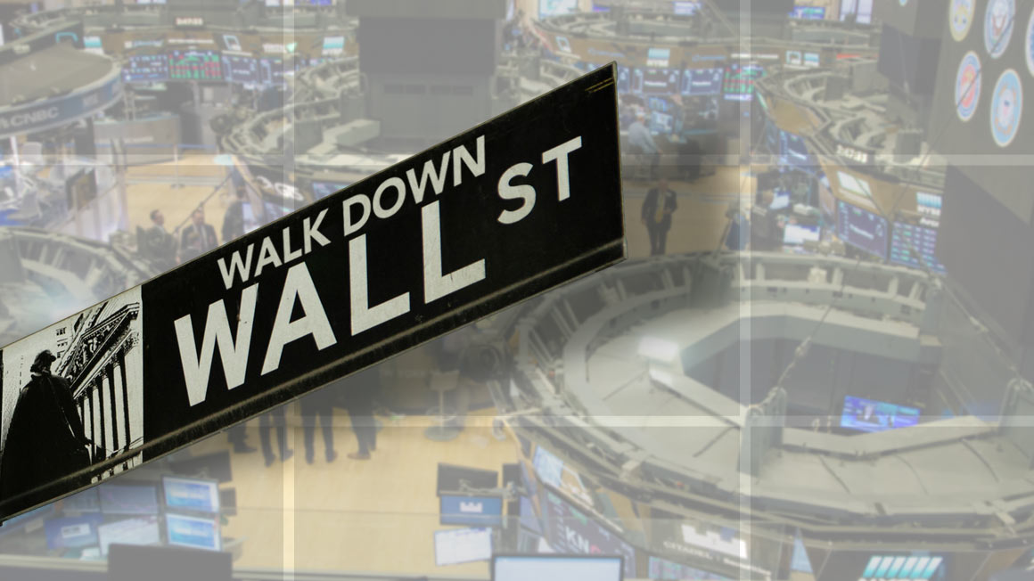 Sign that says Walk Down Wall St over trading floor