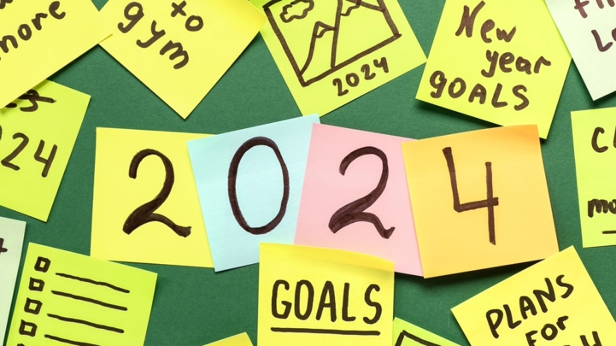 Colorful sitcky notes display 2024 goals.