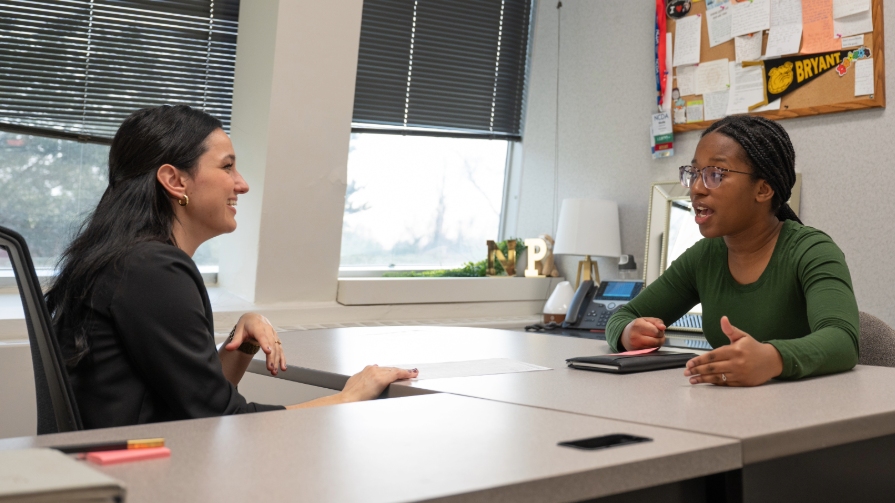 Bryant student discusses career options with career coach.