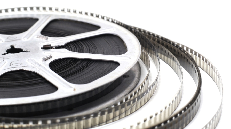 Reel of film laying on flat surface.