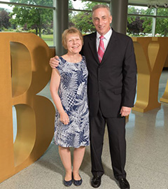     Marion '81 and Frank '81 Hauck P'08 in front of the Bryant letters.
