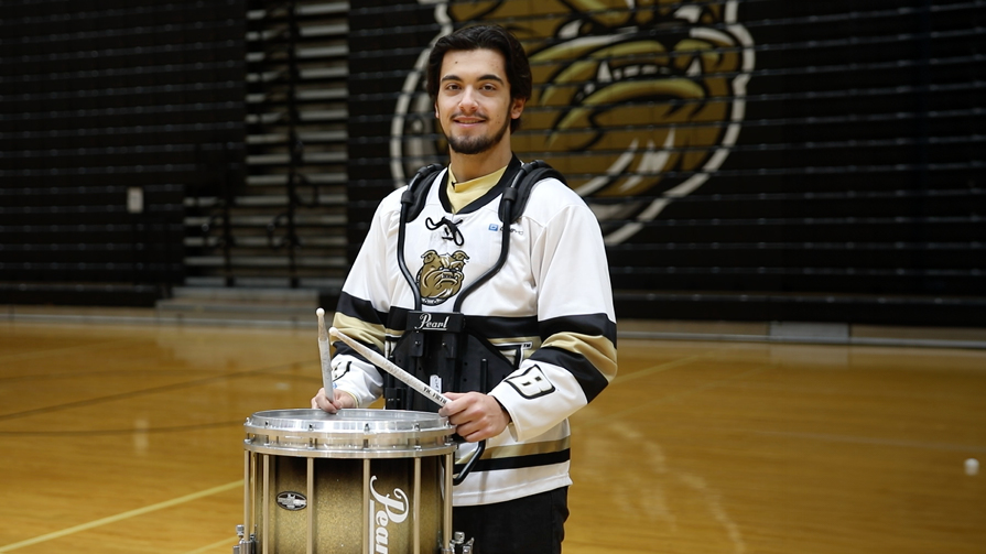 Bryant University student James Tiner in his band uniform