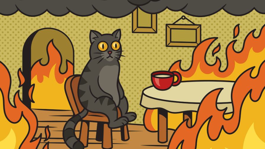 Meme of cat sitting at table in fire.