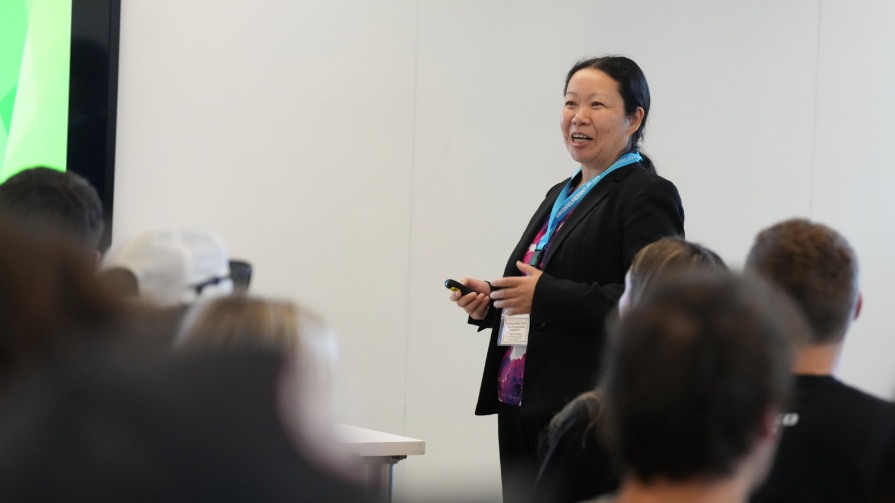 Suhong Li presents at Bryant University's Day of Understanding.