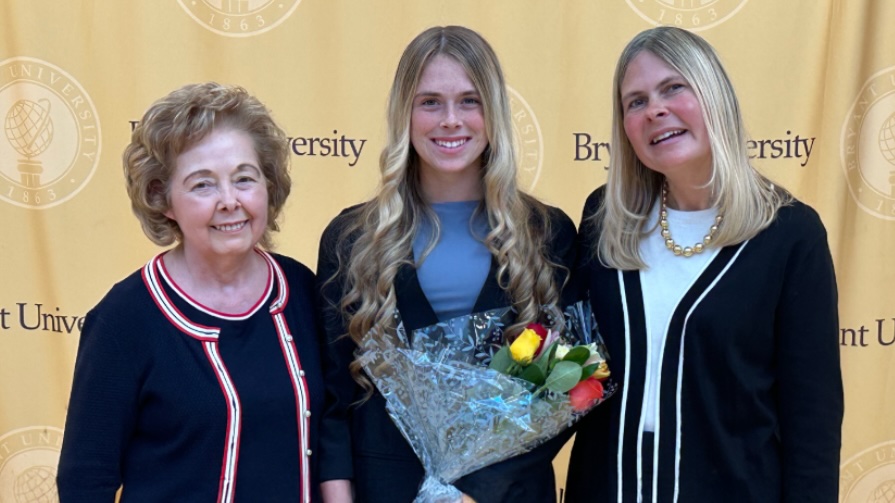 Bryant student Hannah O'Brien posing with her grandmother, Lorraine (Fitleau) Dykas '72 , and mother, Colleen O’Brien ’96