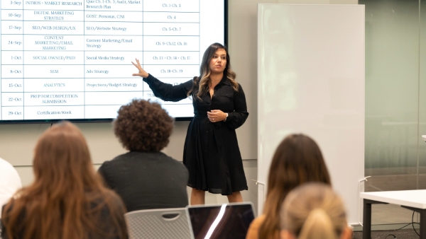 Professor Sharmin Attaran, Ph.D., director of the Digital Marketing program shows off the capabilities of the Digital Maqrketing Lab.