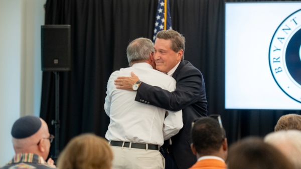 Jim Brady ’81 hugs Professor Emeritus of Accounting Michael Lynch, Ph.D.