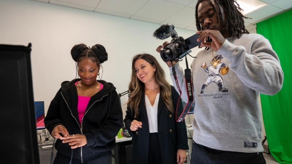 Students practice with the camera in the Digital Marketing Lab