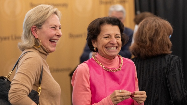 Ellen Wilson ’79, chair of Bryant’s Board of Trustees, shares a laugh with Inge Lise-Ameer, Ed.D, Bryant’s vice president of student affairs, dean of students, and chief diversity officer.