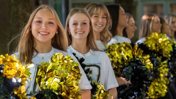 Cheeleaders with popm poms.