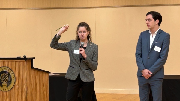 Bryant University student Emerson Swartz presents her team's results at the Global Supply Chain Management Practicum presentation