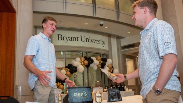 Chase Whitman ’27, co-proprietor of Chip’s Sunflower Seeds, discusses his company at the Entrepreneurship Exposition. 