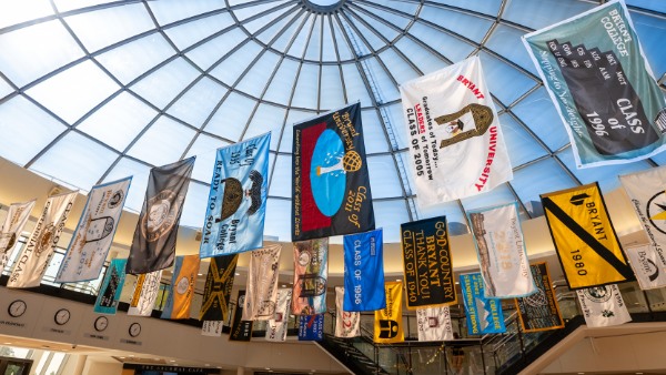 Class flags from throughout Bryant's history eagerly awaited the return of the university's alumni.