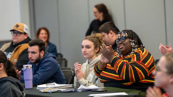 Bryant students clap during Visiting Writers Series master class.