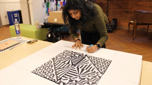 Pushpika Thoutireddy works on a mandala.