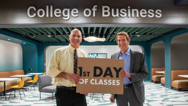 Todd Alessandri, Ph.D., Bryant’s dean of the College of Business, welcomes students to the BELC with Bryant University President Ross Gittell, Ph.D.