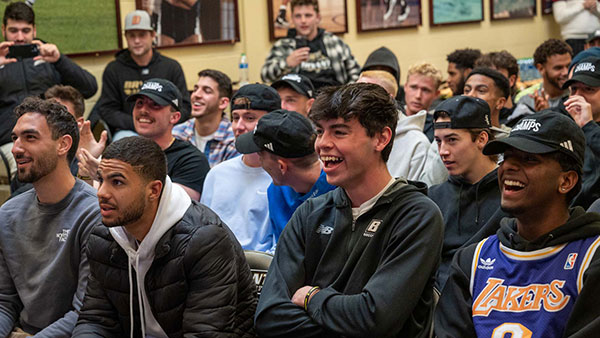 The Bryant men's soccer team reacts during the NCAA tournament selection show on Monday, Nov. 13.