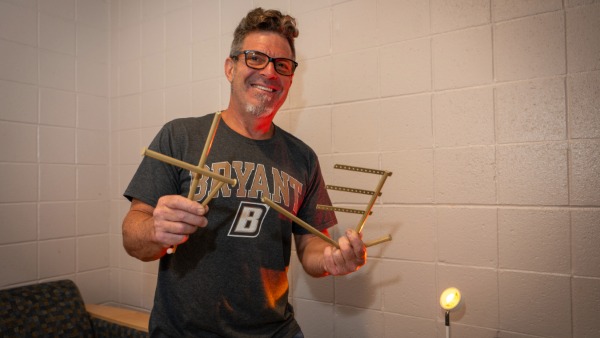 Bryant dad puts jewelry stand together.